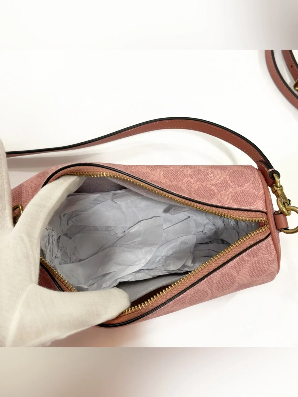 New Coach cylinder barrel bag in melon pink/ brass with signature canvas